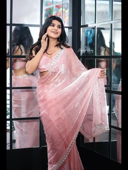 I love how this baby pink organza saree looks against our modern window-pane mirror prop. It’s a great example of how you can use different parts of the studio to create unique, stylish shots for your portfolio or social media.