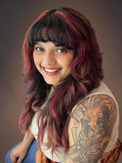 Hair should be fun and reflect your personality. For Amrapali, I created this rock-chick shag haircut with bold red accents framing her face, a style that's as cool and edgy as she is.