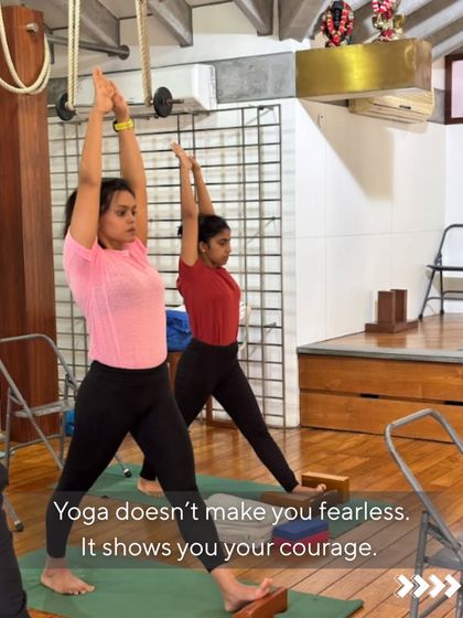 Yoga does not make you fearless. It shows you your courage. These students are practicing standing poses using blocks for stability. This support allows them to find their inner strength and stand tall, both physically and mentally.