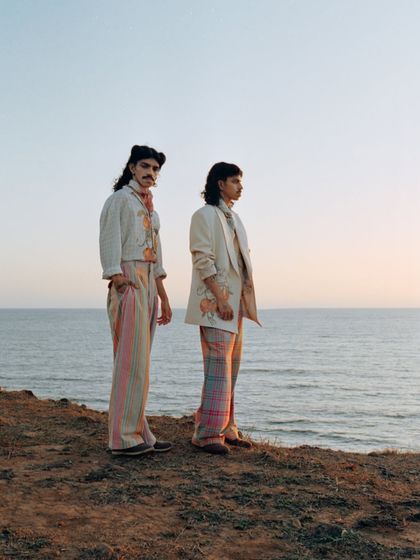 A wider environmental shot that places the styled looks within a beautiful coastal landscape. This shows my approach to location scouting and using the environment to enhance the fashion narrative.