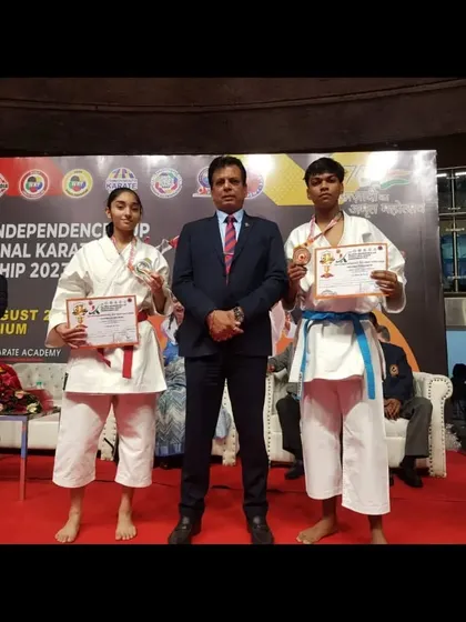Two of our senior athletes, a red belt and a blue belt, after their successful bouts at the international championship.