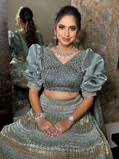 Sangeet glam goals. This look features soft yet defined smokey eyes and a hint of sparkle, designed to make any bride-to-be feel like a star on her big day.