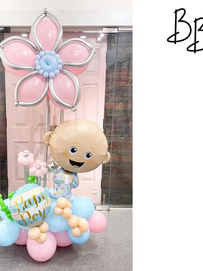 Oh boy! This Boss Baby arrangement is perfect for celebrating the arrival of a little prince or for a first birthday. The character balloon is paired with a soft blue and pink color scheme and a large balloon flower.