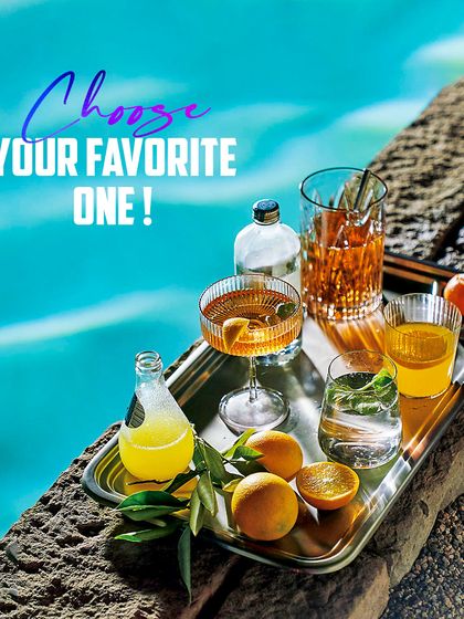 Choose your favorite one! A tray of assorted refreshing drinks by the water offers a vision of a perfect, relaxed celebration, all curated by us.