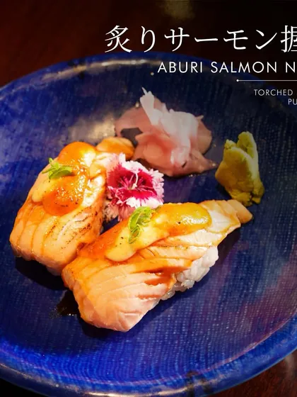 Experience the sublime flavor of our Aburi Salmon Nigiri. We lightly torch premium salmon to unlock a smoky aroma and a melt-in-your-mouth texture that is pure bliss. Served on a bed of perfectly seasoned rice, this is a modern take on a classic that has become a favorite among our guests.