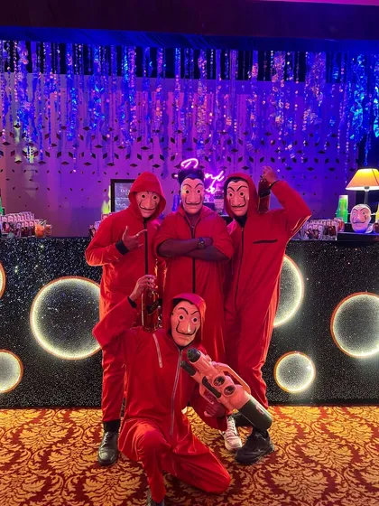 We go all-in on themes. Here's our team ready for a Money Heist themed sangeet, complete with red jumpsuits and masks, proving we're not just bartenders, we're part of the entertainment.