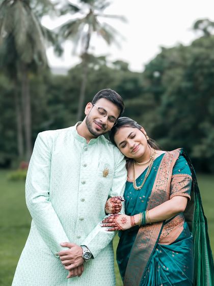 A peaceful, romantic portrait from a pre-wedding shoot. The way she rests her head on his shoulder shows their deep comfort and affection for each other.