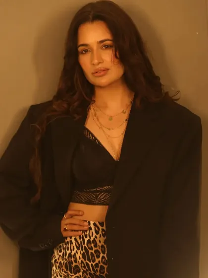 This shot is all about the hair. The long, healthy, voluminous waves are the result of careful styling to create a look that is both glamorous and natural.