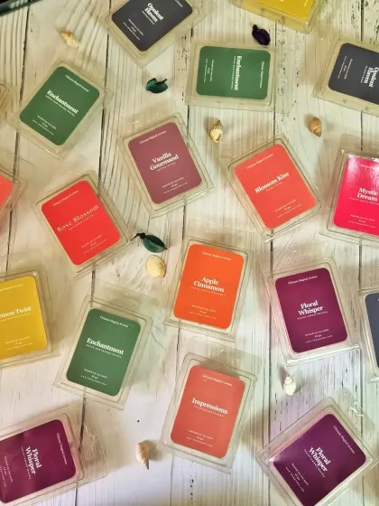 A vibrant display of my soy wax melts, available in eleven different scents. They are a wonderful flameless option to fill your home with fragrance, perfect for those hot summer days or any time you want a burst of aroma.