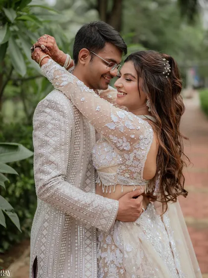 This is what pure happiness looks like. We specialize in creating a comfortable atmosphere where you can be yourselves, resulting in genuine, candid couple portraits like this intimate embrace, set against a lush, natural backdrop.