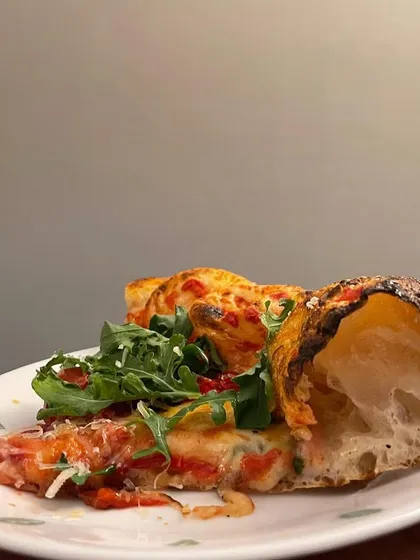 A perfect cross-section of my contemporary artisan Neapolitan crust. You can clearly see the airy pockets created by the long fermentation process. This is what I mean by dough science.