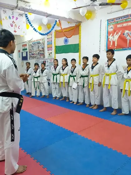I am addressing the students before their belt test, explaining the requirements and offering words of encouragement.