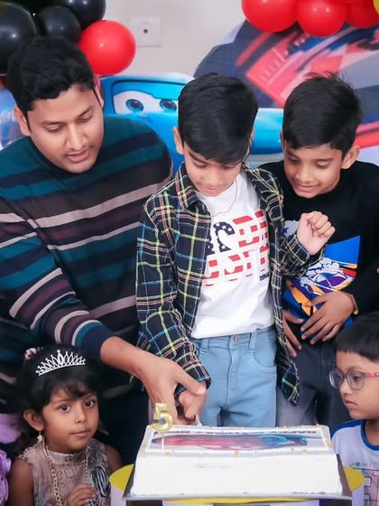 A magical 'Mermaid' themed birthday party, with shimmering blue and green decor, seashell props, and mermaid cutouts, creating an enchanting underwater world.