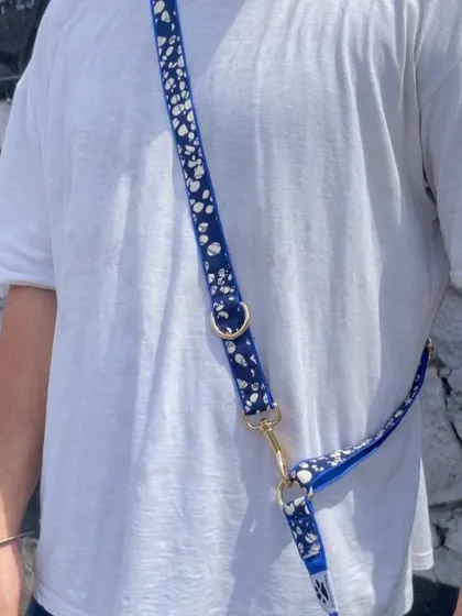 A close-up of the cross-body leash being worn. You can see how it adjusts to fit comfortably, distributing the weight and making walks more enjoyable.