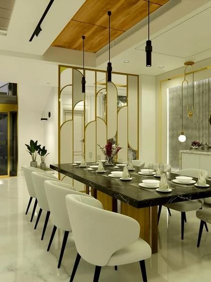 The dining area of "Yash Villa," with a modern 10-seater table, elegant chairs, and a decorative screen with brass accents that provides partial separation.