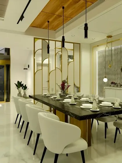 The dining area of "Yash Villa," with a modern 10-seater table, elegant chairs, and a decorative screen with brass accents that provides partial separation.
