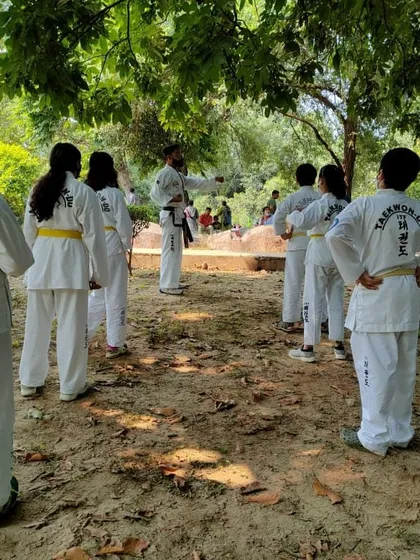 Students listening attentively to instructions. A strong mind and the ability to focus are as important as physical skill.