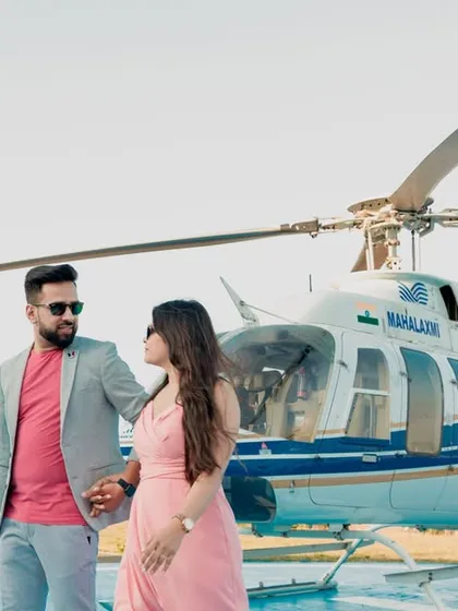 Making a grand entrance into their new life together. This stylish shot from a helicopter pre-wedding shoot in Pune is the definition of luxury and modern romance, creating an unforgettable memory.
