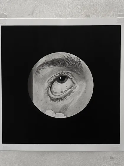 The framed version of one of my hyper-realistic eye drawings. The black background makes the details pop.