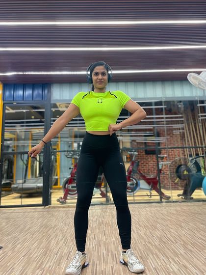 A confident front pose, ready to start a new week of training and coaching.