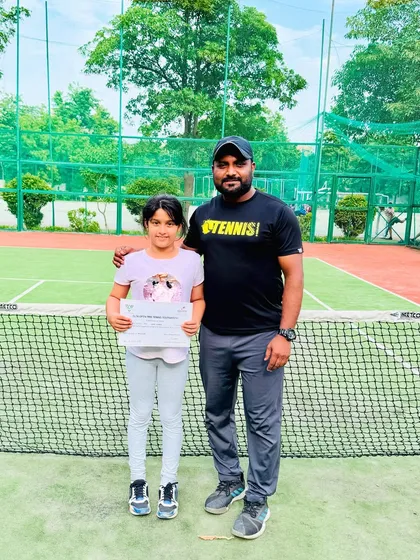 Here I am with Ziya, celebrating her first step into the world of competitive tennis at the DLTA Open Mini Tennis Tournament. This is just the beginning for a promising young player.