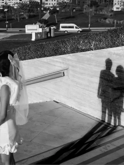 A creative use of shadows in this black and white photograph from Baku. The couple stands looking at their elongated shadows, creating a powerful, symbolic image about their shared path forward.