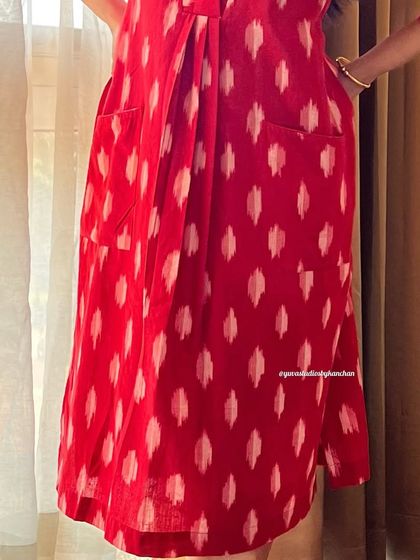 A detailed shot of the pockets and fabric of our bestselling red handloom Ikat dress-cum-kurta.