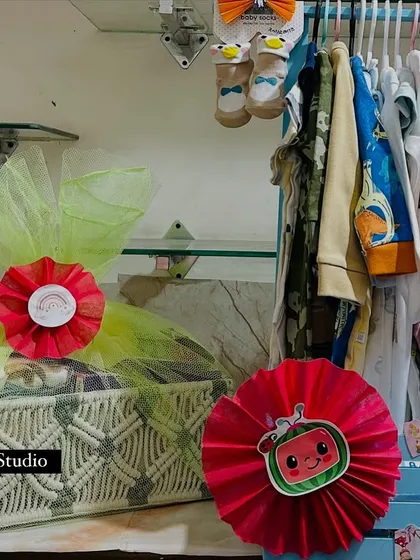 A side-by-side look at two popular baby gifting options: a macrame basket with a Cocomelon theme and the baby wardrobe hamper.
