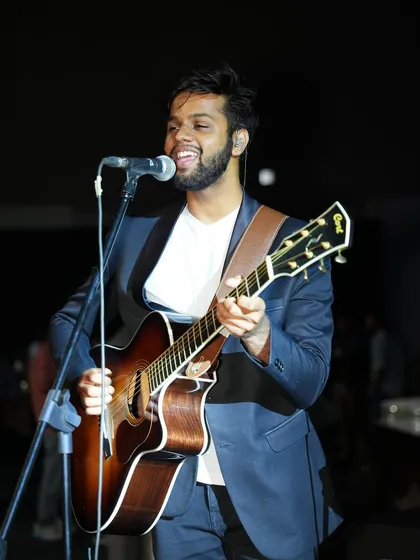 Our guitarist Joshua delivering a solo during an acoustic set. He is a versatile multi-instrumentalist who adds a dynamic edge to our performances.