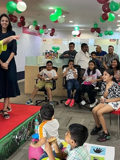 I always make sure the kids who volunteer feel like stars. This young man is pointing out something amazing to the audience, fully engaged in his role as my magical assistant.