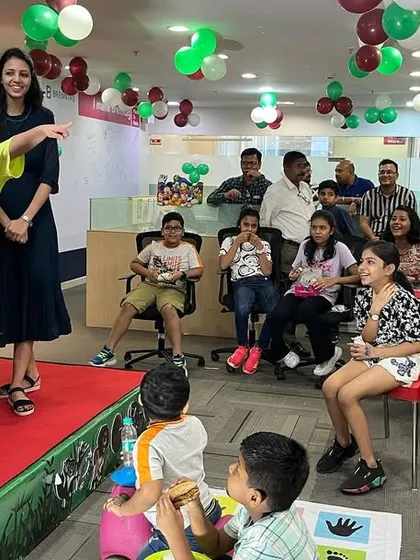 I always make sure the kids who volunteer feel like stars. This young man is pointing out something amazing to the audience, fully engaged in his role as my magical assistant.