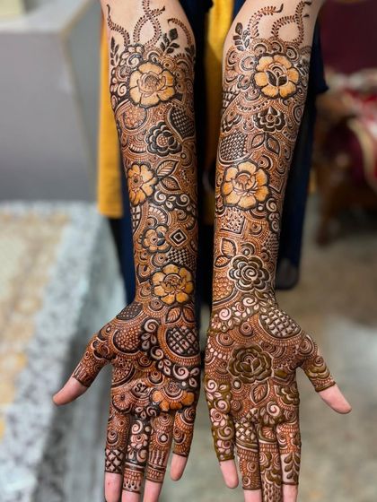 A full, clear shot of the floral engagement mehendi, perfect for seeing the entire design at a glance.
