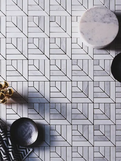 We love finding creative ways to be sustainable. This intricate floor pattern was designed using leftover pieces of marble, transforming waste material into a unique and modern geometric feature.