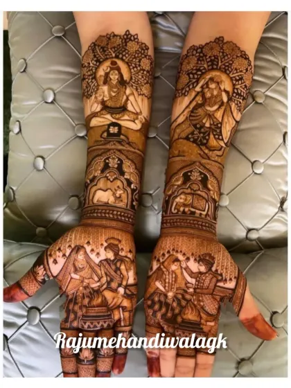 A divine theme for a wedding, this design includes the wedding of Shiva and Parvati on the arms, with the bride and groom's own pheras on the palms.