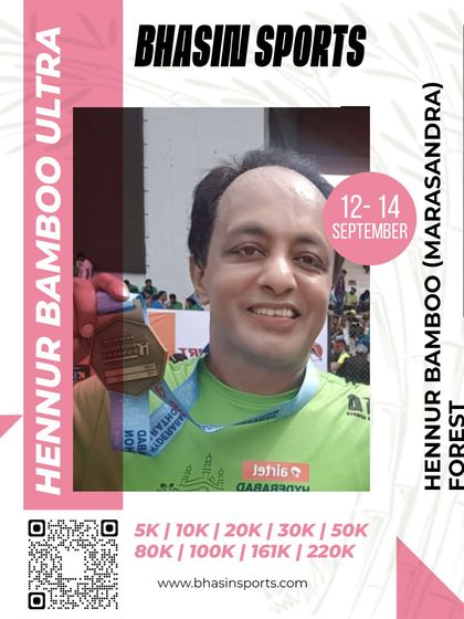 A close-up of a finisher proudly showing off his medal. The custom-designed medals are a cherished memento of the race experience.