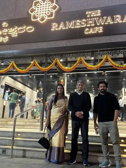 This is the result of a clear vision and relentless execution. Standing with my husband and partner outside our bustling Rameshwaram Cafe, a testament to our success in the competitive F&B industry. I help my clients build brands that people line up for.