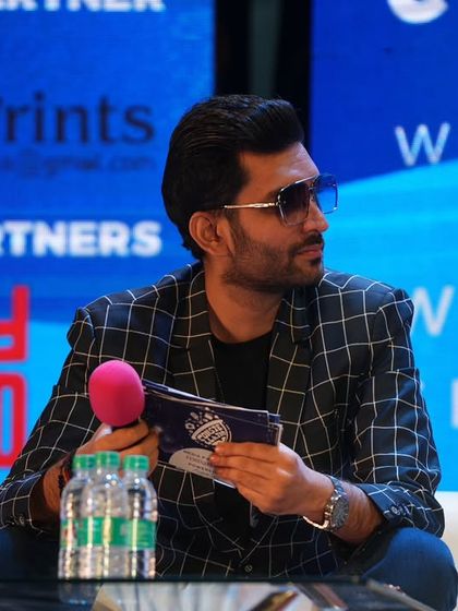 Another angle of me moderating the panel, showcasing my professional yet approachable style.