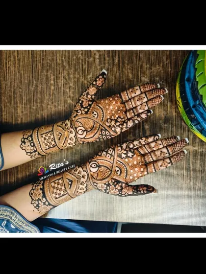Another angle of the peacock-themed design, showing how the patterns flow beautifully from the palm to the arm.