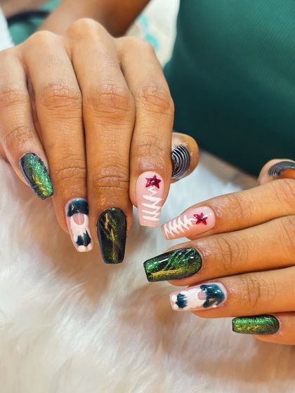A unique and artistic festive set, featuring green cat eye nails, abstract patterns, and cute character details.