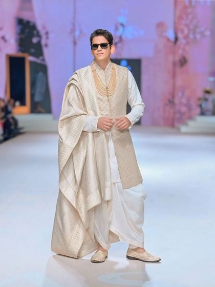 Actor Vijay Varma walking the ramp at Lakme Fashion Week. His cool demeanor and stylish ethnic wear make for a striking fashion photograph.