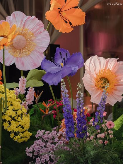 A detailed shot of the handcrafted flowers, showing the variety of shapes, colors, and materials used.