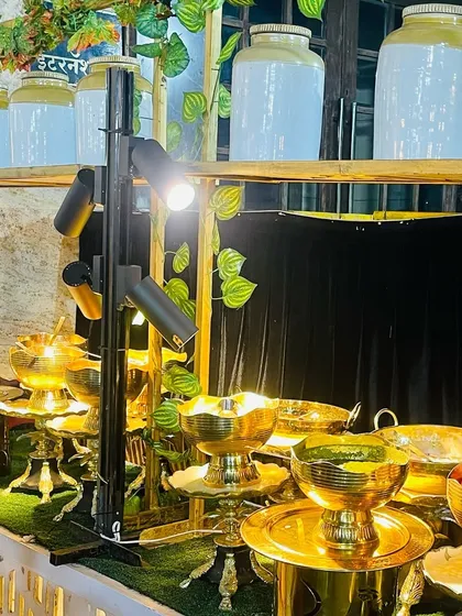 Even a simple salad station gets a touch of elegance. Here, I used golden serveware and focused lighting to elevate the presentation and make healthy options look appealing.