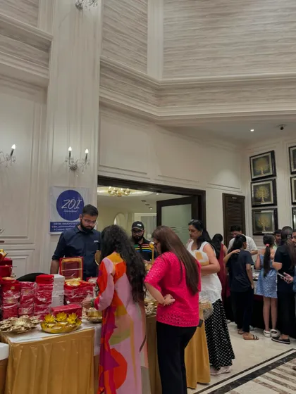 A busy stall with customers crowding around to see the products. This is the kind of energy I aim to create.