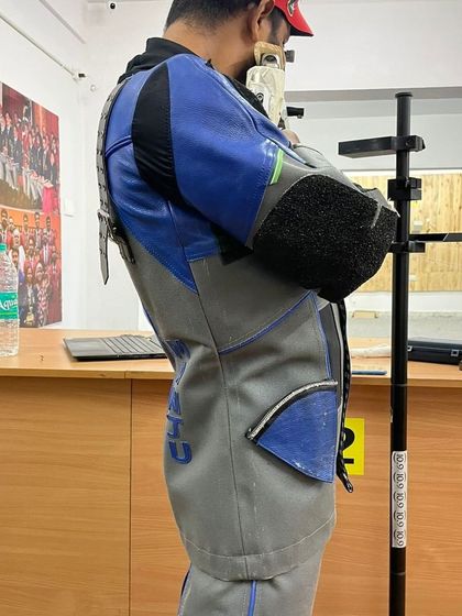 This side profile shows the correct standing posture for 10m Air Rifle. The stability of the body is the platform for a perfect shot, and we spend significant time perfecting this foundation.