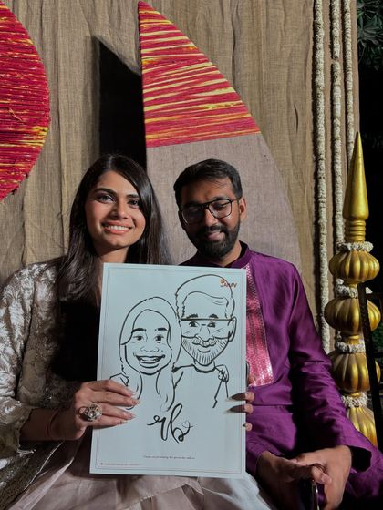 A couple poses with their black and white caricature, a classic and timeless style that I offer.