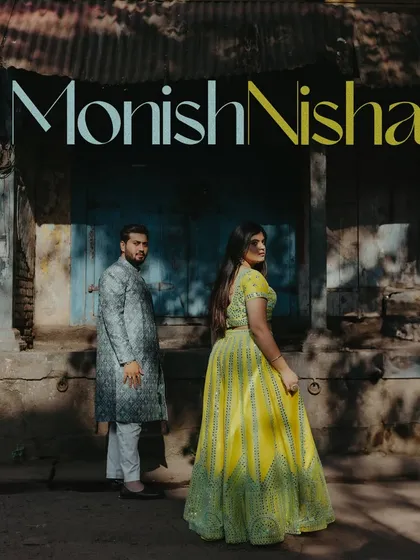 An editorial-style pre-wedding portrait in the old city of Nashik. The contrast between the couple's modern traditional wear and the rustic backdrop creates a unique visual story.