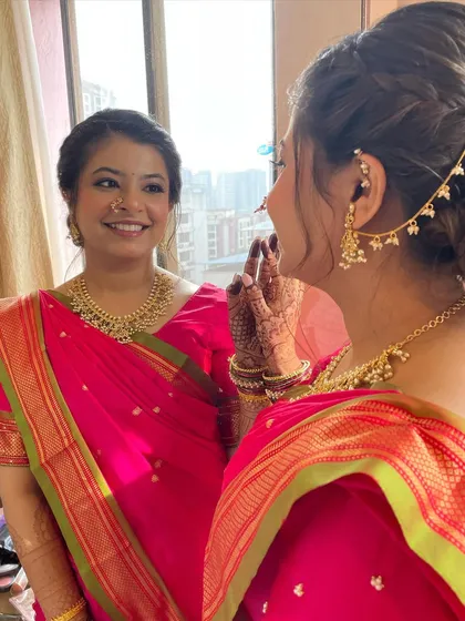 One of the freshest Marathi looks I've created. The bride looks radiant and happy in her pink saree, with a simple hairstyle and natural makeup.