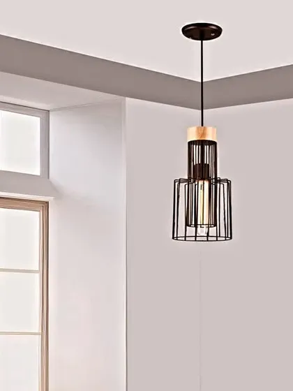 This metal hanging light features a black cage design with a wooden accent. The industrial-inspired aesthetic is perfect for adding a touch of modern, rustic charm to your kitchen or dining area.
