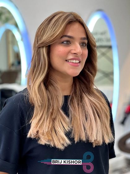 The beautiful waves and soft tones of the creamy peach ash blonde are on full display here.