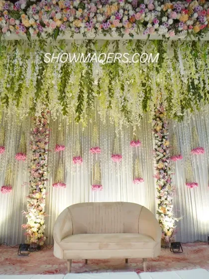 This magnificent stage setup for a Roka ceremony showcases our expertise in floral design. A canopy of hanging wisteria and a lush floral border create a romantic and enchanting backdrop, perfect for capturing beautiful moments. We specialize in creating these large-scale floral masterpieces.